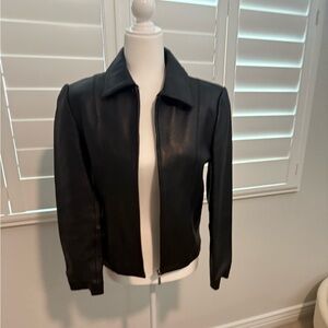 Women’s small black genuine lambskin leather jacket.